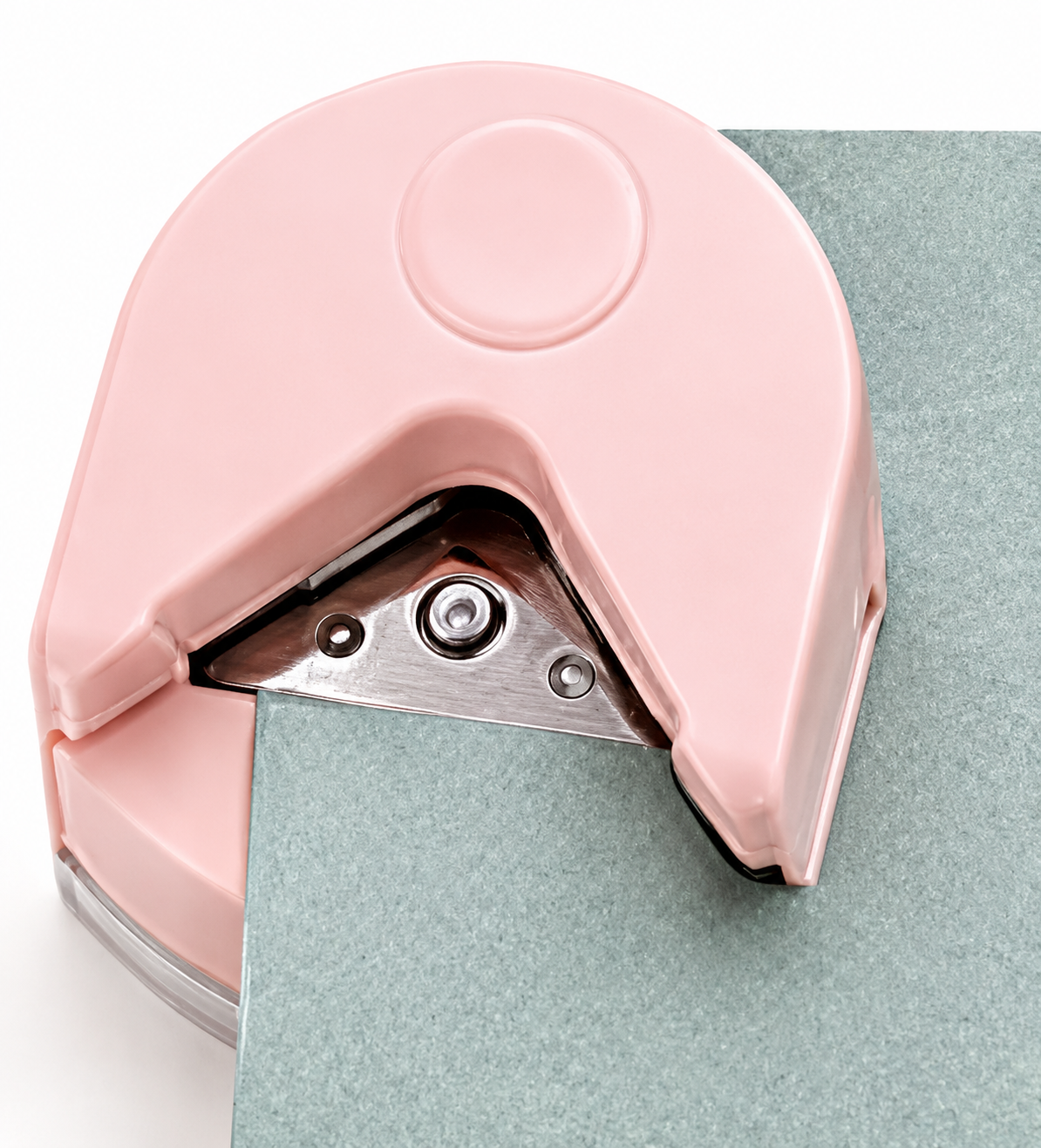 Inserting a paper corner into the rounder