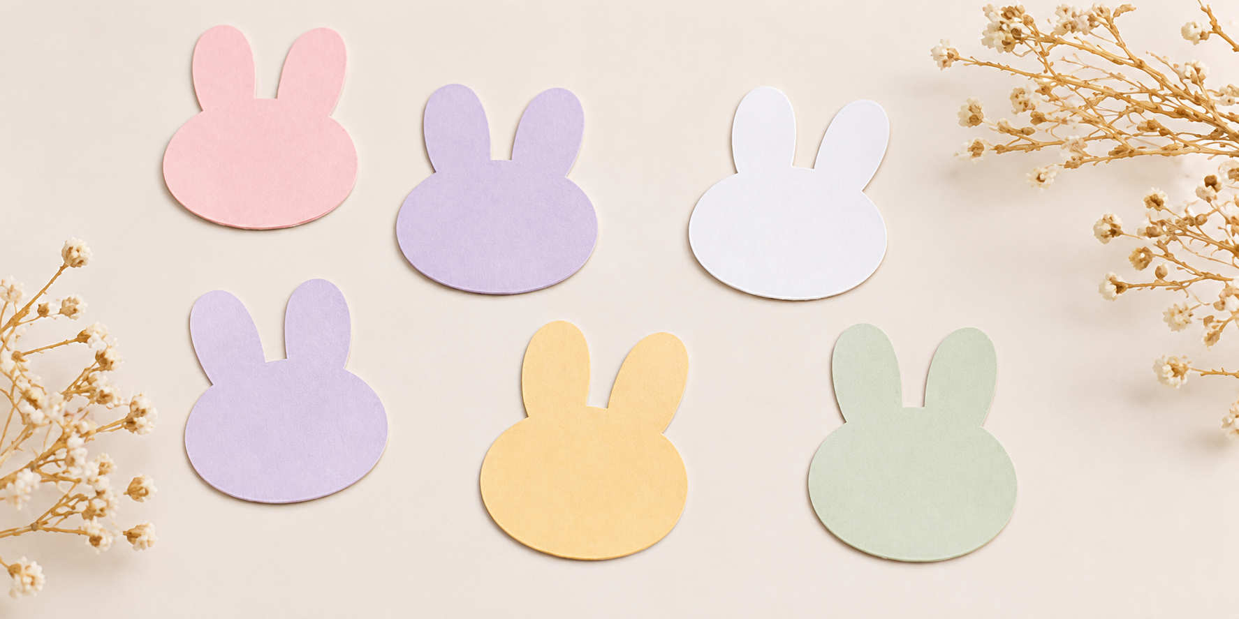 The same paper with punched bunny shapes