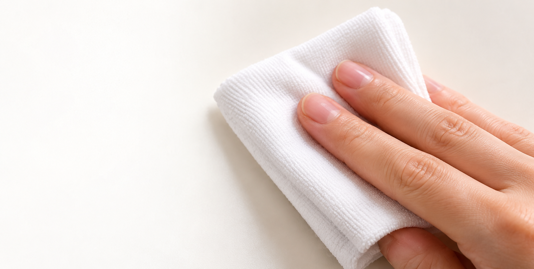 Wiping a surface clean before applying a sticker
